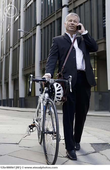 businessman_pushing_bicycle_12br0009rf.jpg